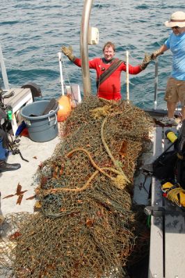 Crew hauling net onto stern