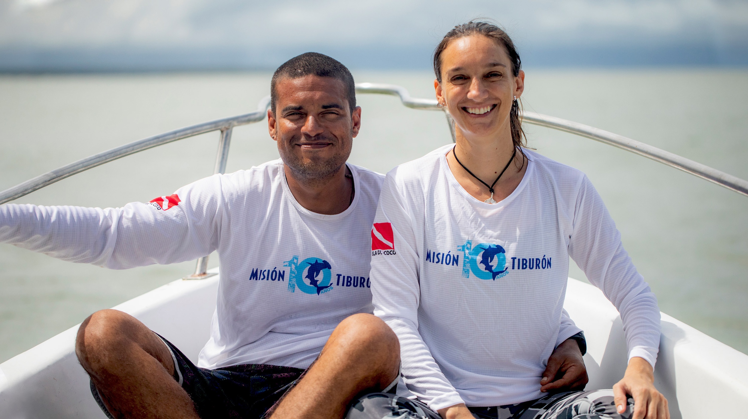 A young man and woman on a boat at sea - Misión Tiburón founders Andres Lopez and Ilena Zanella. Credit - Misión Tiburón.